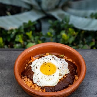 Arroz con Mole topped with a Fried Egg